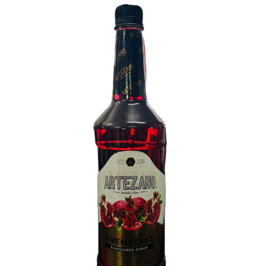 Bottle of Artezano Grenadine syrup on a bar counter with a blurred bar background
