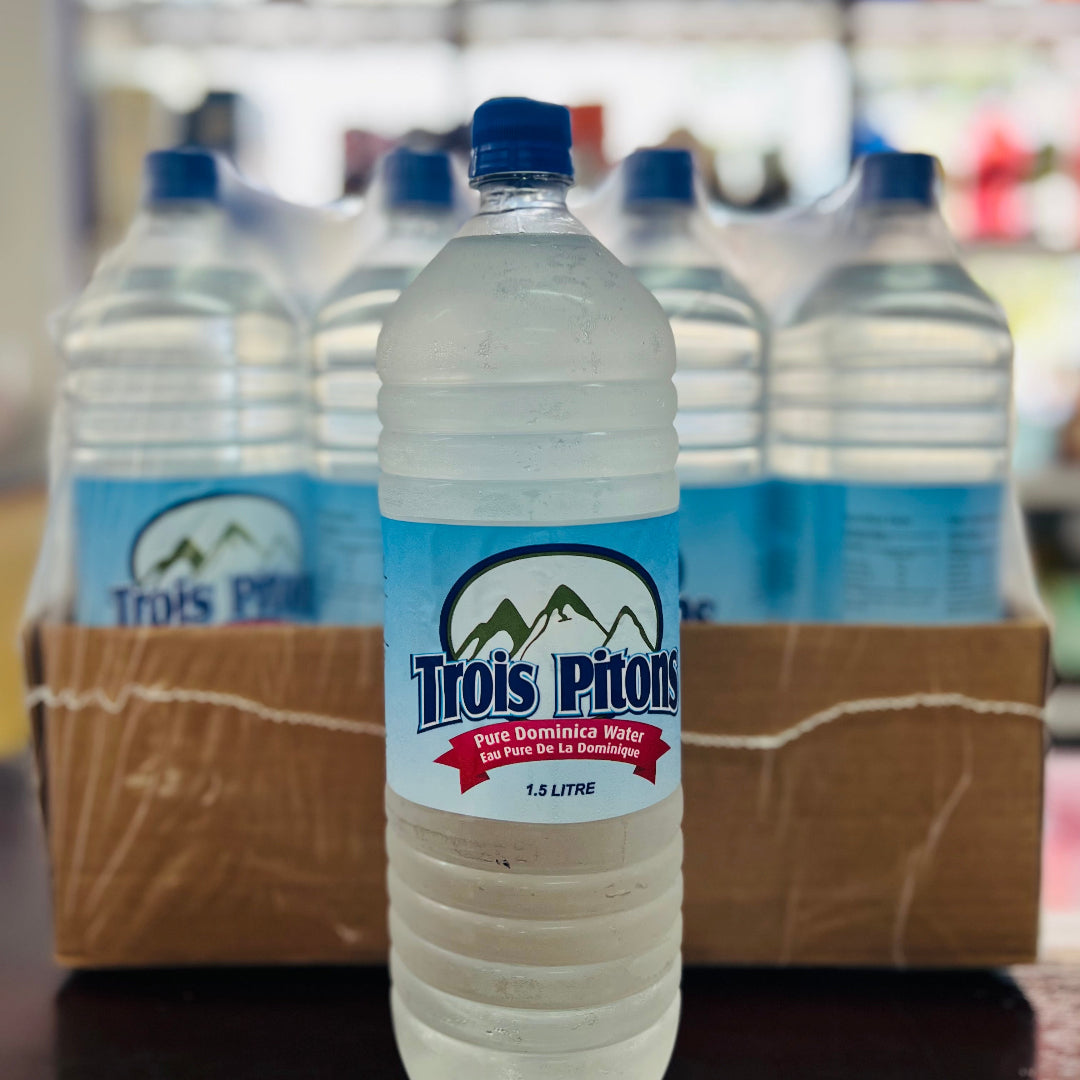 Bottle of Trois Pitons water with a cardboard box in the background