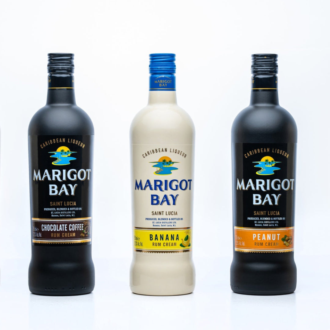 Five bottles of Marigot Bay rum with different flavors on a white background