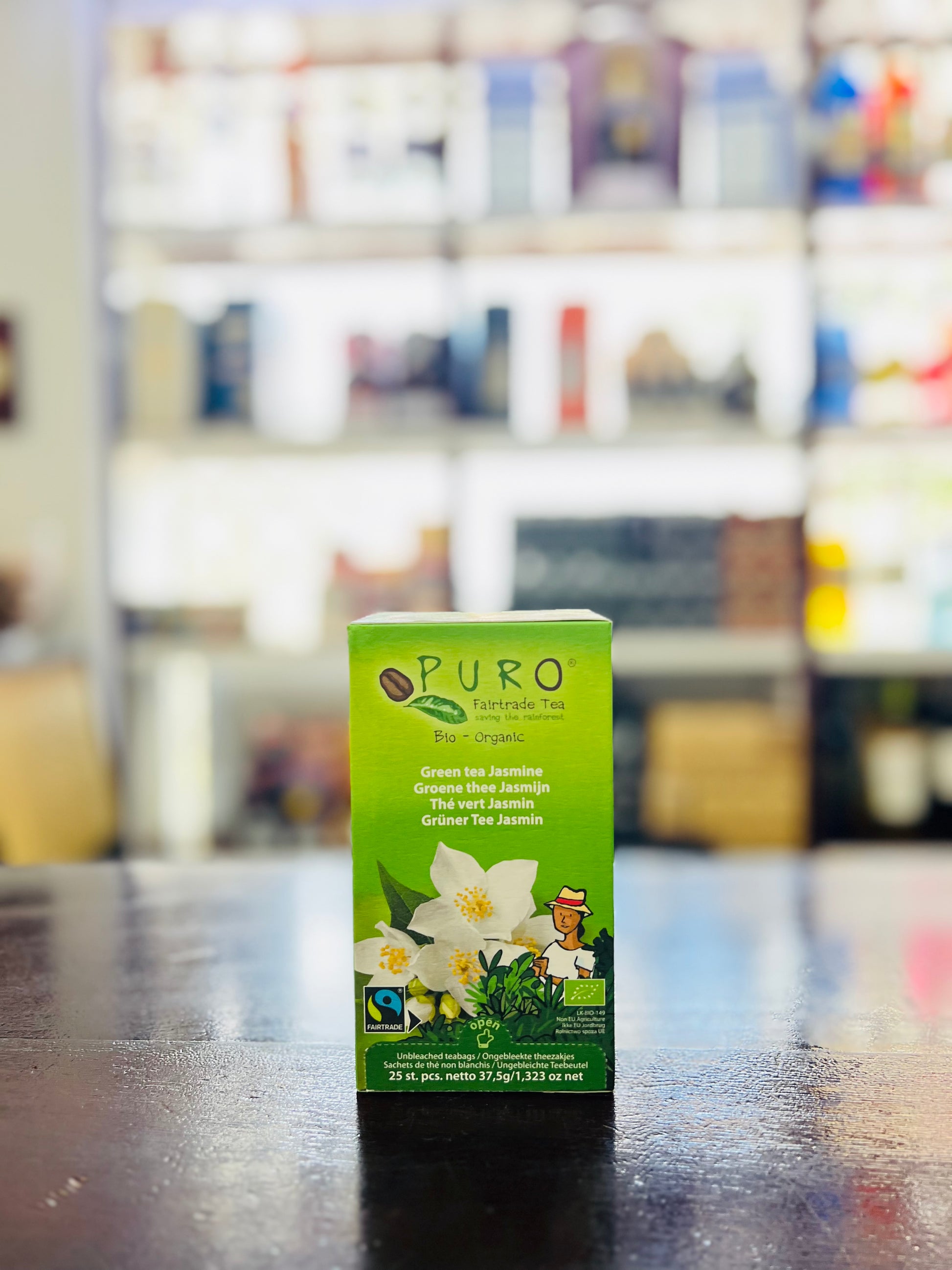 Puro tea box on a table with a blurred store background