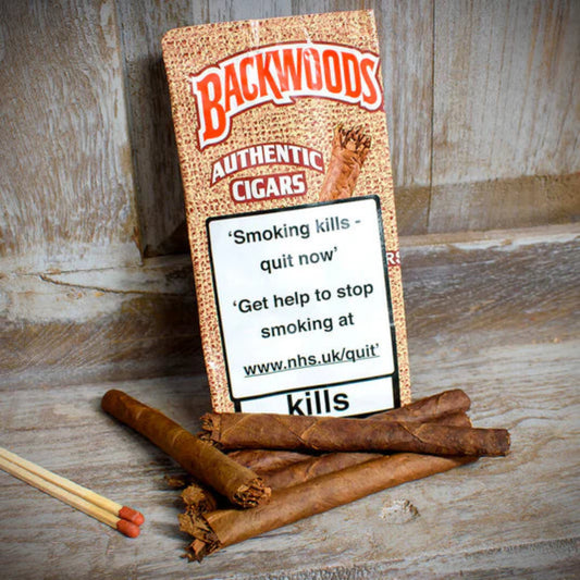 Backwoods Authentic Cigars packaging with warning label on a wooden surface