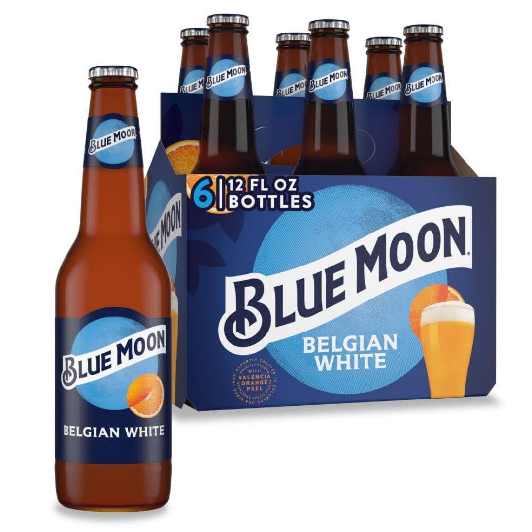 Six-pack of Blue Moon Belgian White beer bottles with packaging on a white background