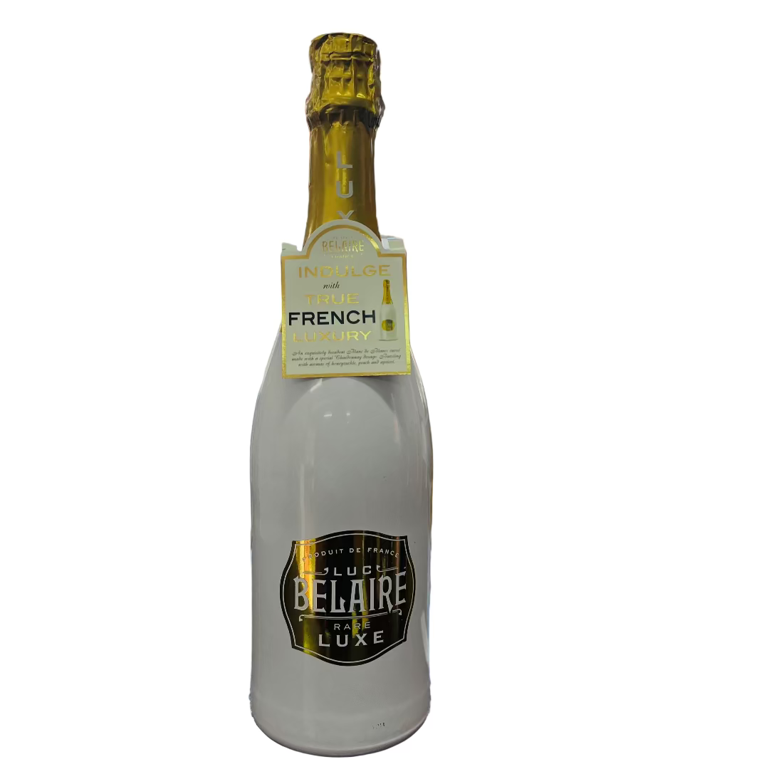 Bottle of Belaire Luxe on a bar counter with a blurred bar background