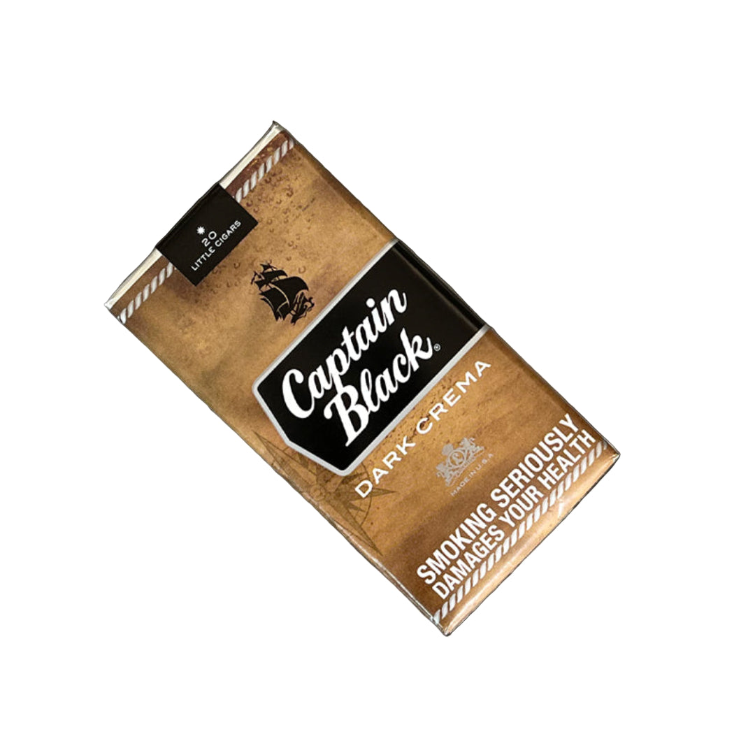 Captain Black Dark Crema cigarette pack on a marble surface