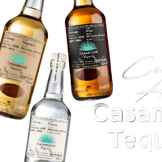 Casamigos tequila bottles with limes, ice, and a cocktail shaker on a dark background.