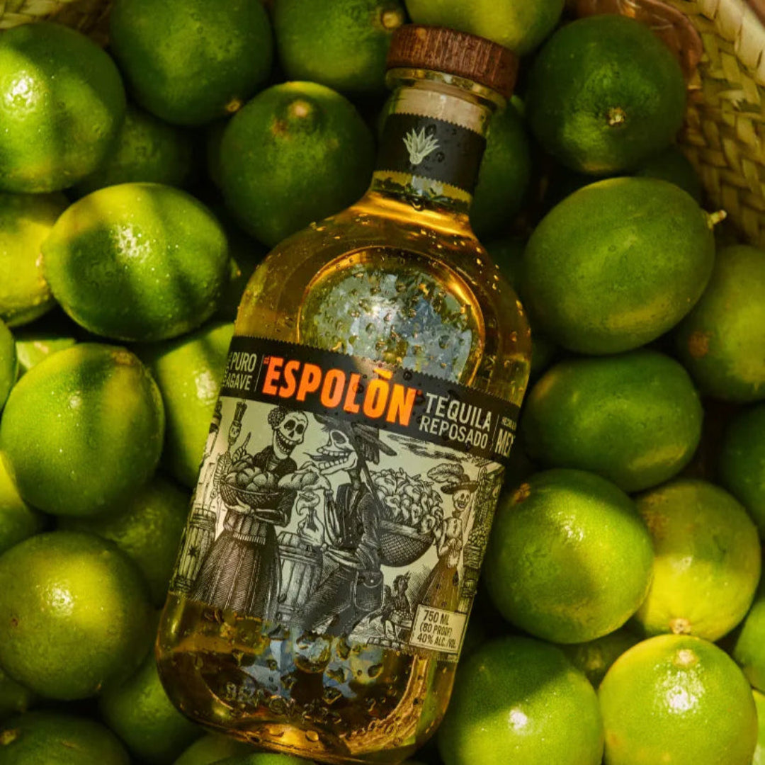 Espolón Tequila bottle surrounded by limes