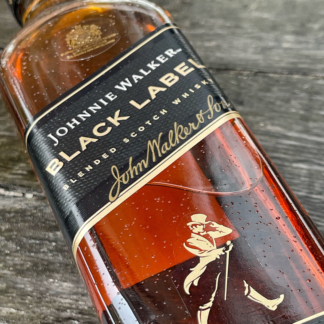 Johnnie Walker Black Label whisky bottle on a wooden surface