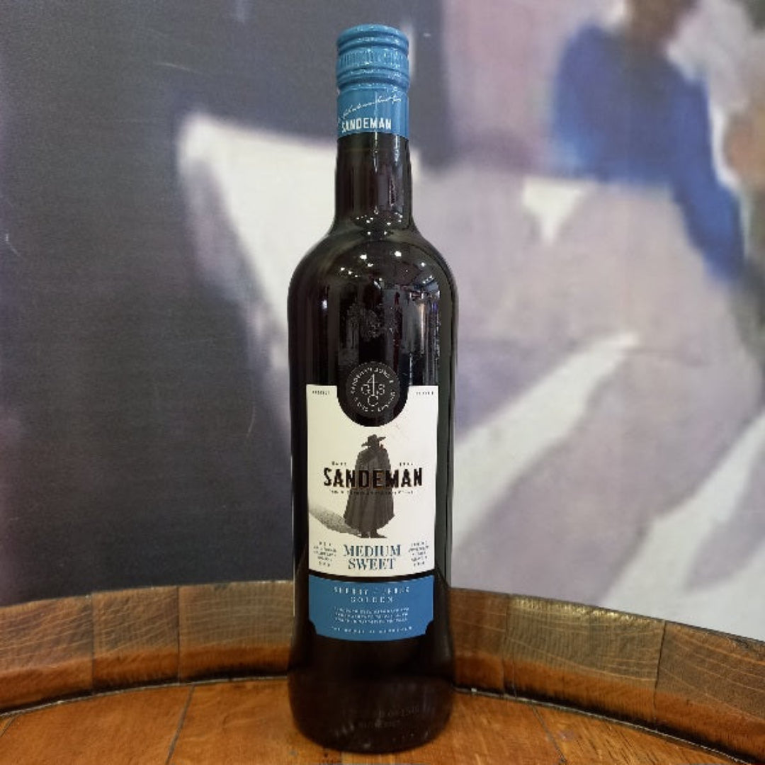 Bottle of Sandeman wine on a wooden barrel with a blurred background