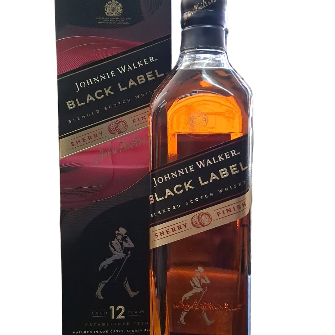 Johnnie Walker Black Label whisky bottle on a counter with packaging in the background.