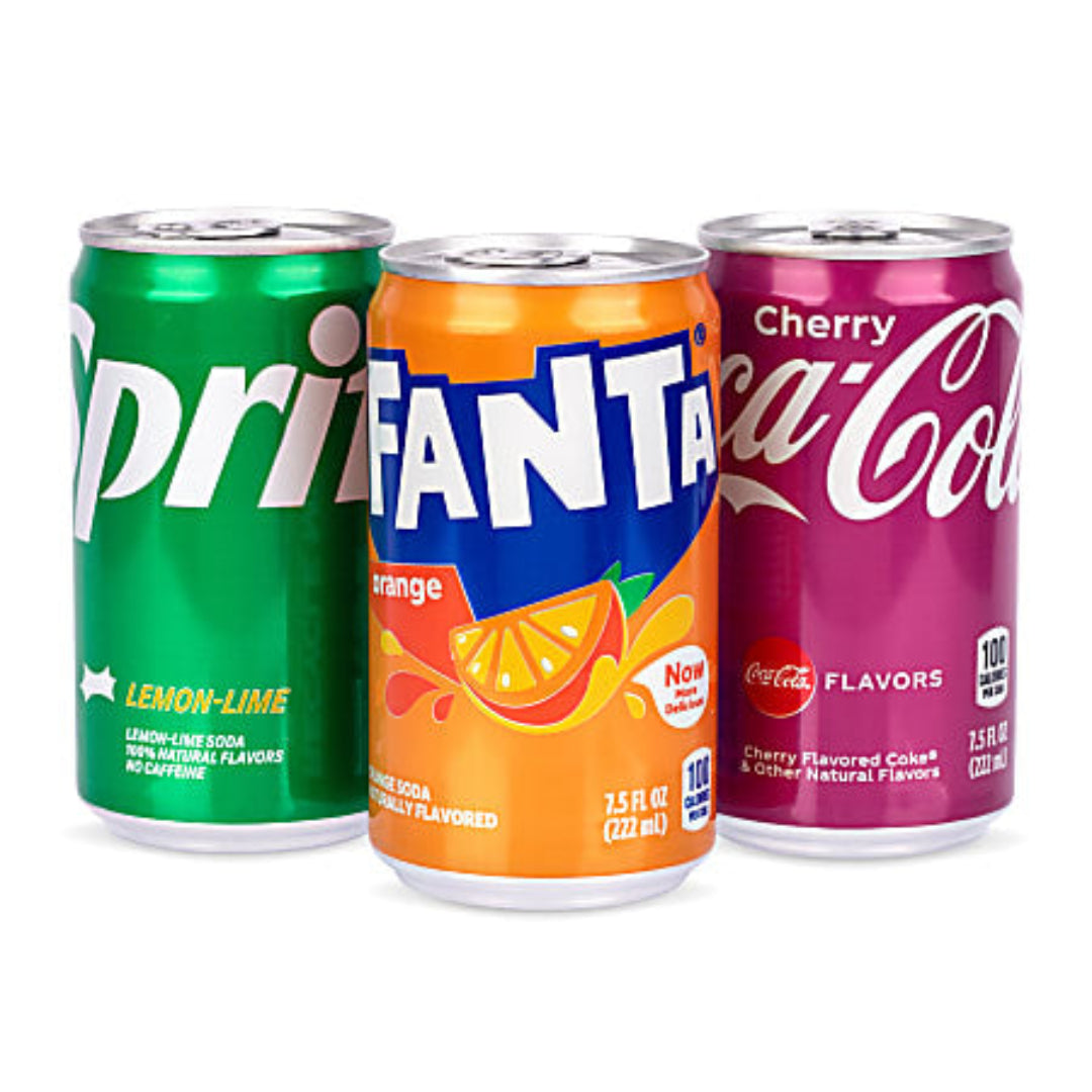 Three soda cans: Sprite, Fanta, and Cherry Coca-Cola on a white background