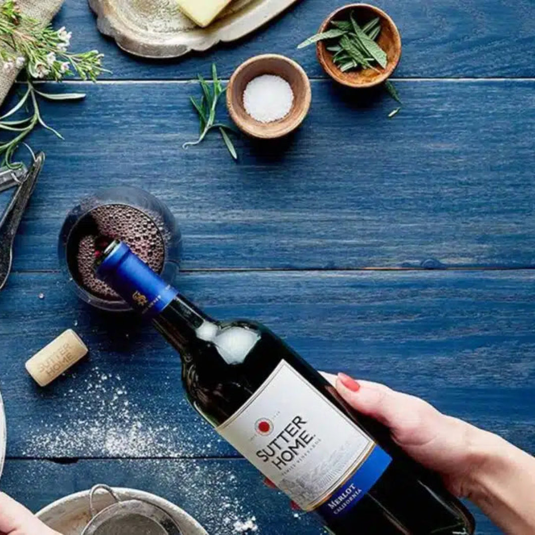 Bottle of wine labeled 'Superiore' on a table with eggs and cooking utensils.