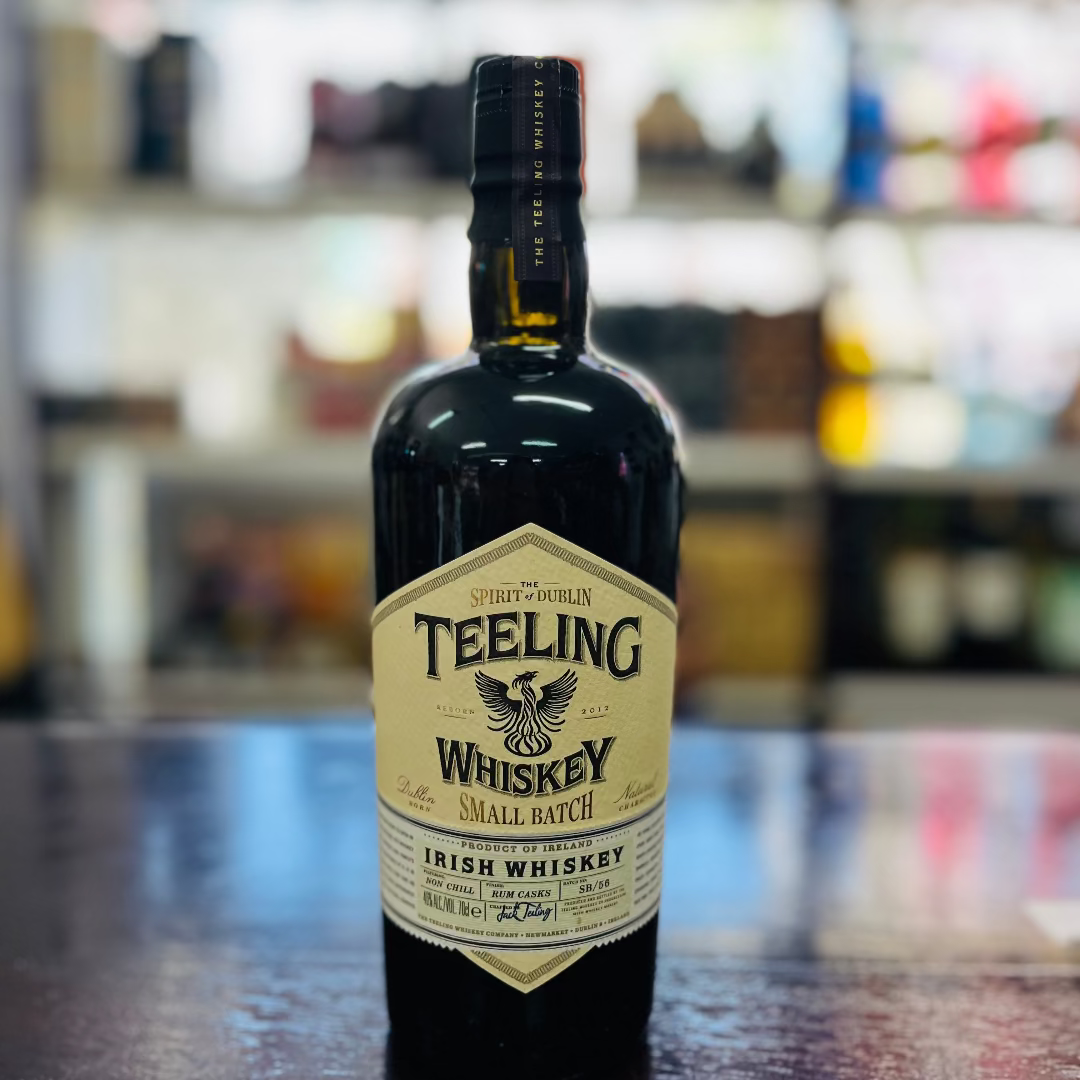 Teeling whiskey bottle on a bar counter with a blurred bar background