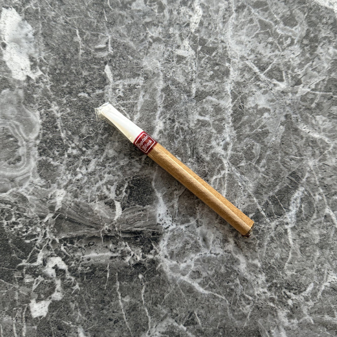 Cigarette on a textured marble surface