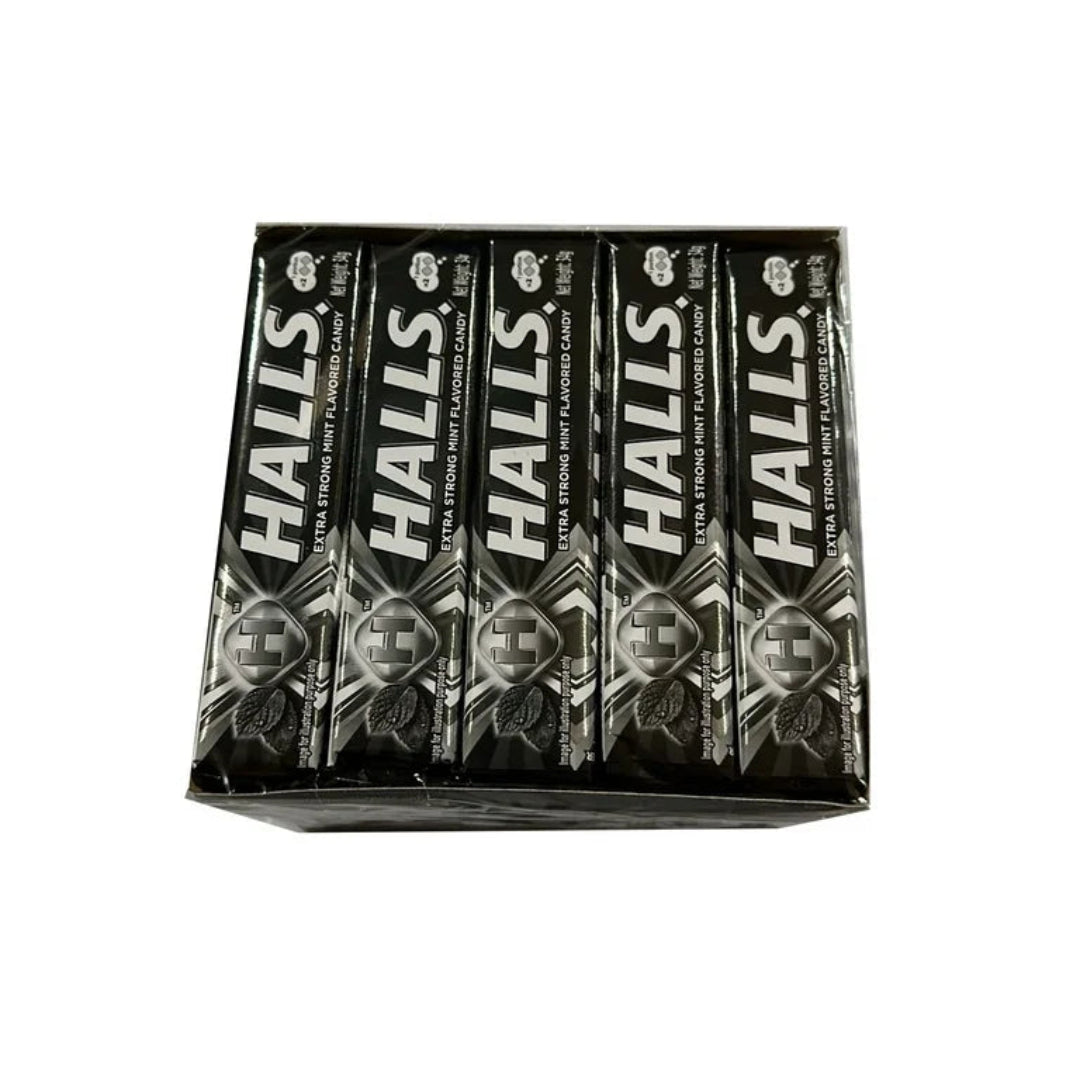 Pack of Halls extra strong black peppermint candy on a white background
