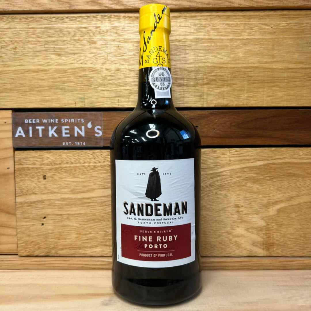 Bottle of Sandeman Fine Ruby Porto wine on a wooden background