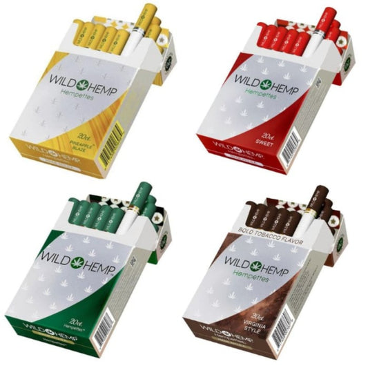 Four packages of Wild Hemp cigarettes in different flavors on a white background